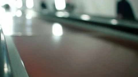 Close-up of escalator's hand railing in the subway moving up. Blurred background Stock Footage 76234180