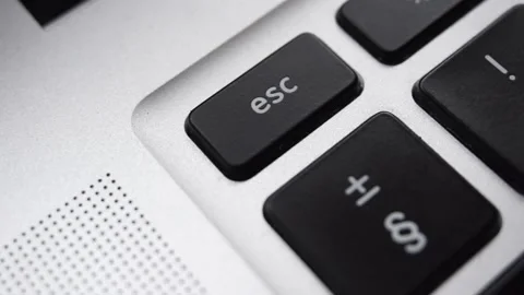 Close up Escape button pushed by a man's hand 库存影片 136386641