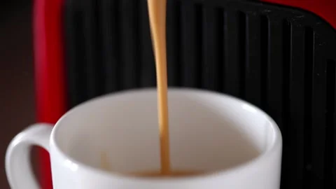 Close up - Espresso Machine pouring black coffee into white cup Stock Footage 231981050
