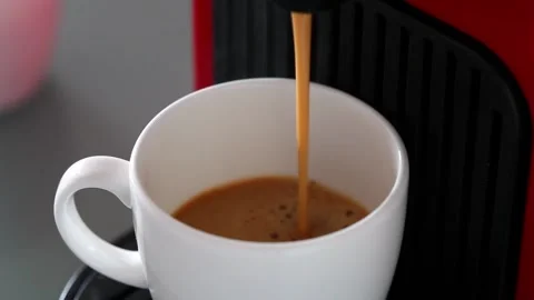 Close up - Espresso Machine pouring black coffee into white cup Stock Footage 231981053
