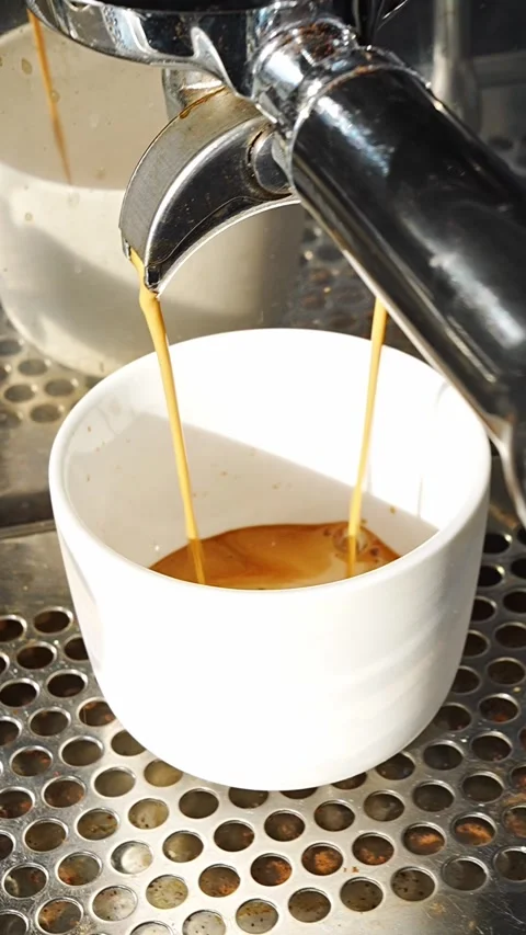 Close-up of espresso machine pouring coffee Stock Footage 345538859