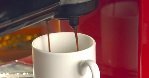 Close-up of espresso machine while coffee goes through 動画素材 99753237