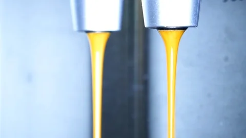 Close-up of espresso pouring from coffee machine 4k intro video for business Stock Footage 98533378