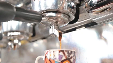 Close-up of espresso pouring from coffee machine. Professional coffee brewing Stock Footage 163110568