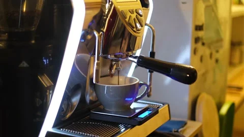 Close-up of espresso pouring from the coffee machine at the cafe Stock Footage 169785876