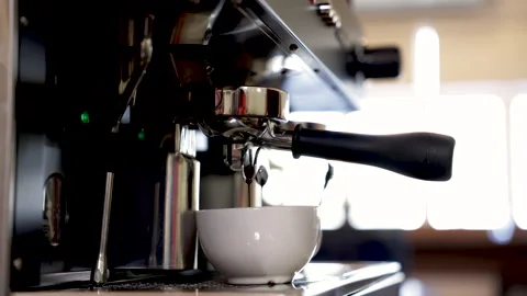Close-up espresso pouring from coffee machine, young barista training girl .. Stock Footage 245050127