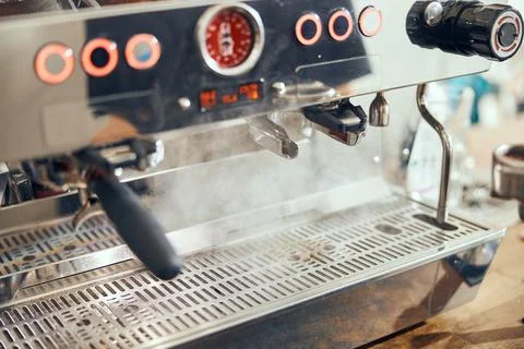 Close-up of espresso pouring from coffee machine. Professional coffee brewing Foto stock
