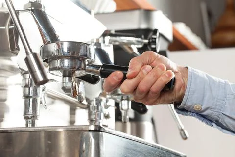 Close-up of espresso preparing in coffee machine, selective focus Stock Photos