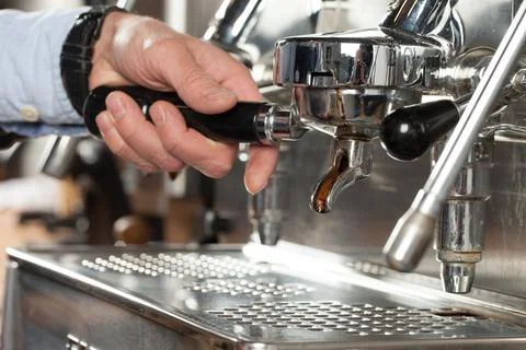Close-up of espresso preparing in coffee machine, selective focus Stock Photos