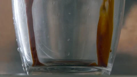 Close up Espresso Pull into Glass Slow Motion Stock Footage 147218427