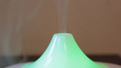 Close-up essential oil diffuser brings out the fragrant smoke Stock Footage 116109703