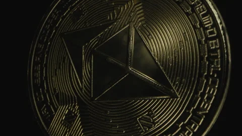 Close-Up of Ethereum Coin, Highlighting Its Angular Symbol and Circuit Details Stock Footage 296514475