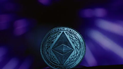 Close-up: Ethereum physical coin on an abstract background. Golden ETH logo with Stock Footage 332619114