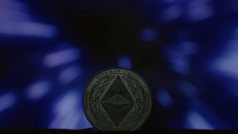 Close-up: Ethereum physical coin on an abstract background. Golden ETH logo with Stock Footage 332620400