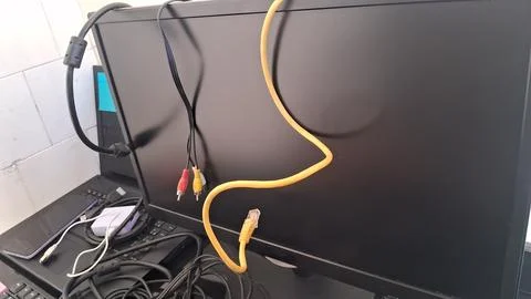 Close-up of ethernet cable connected to laptop port. High-speed internet Stock Photos
