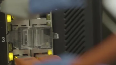 Close-up of Ethernet cables plugged into a network switch Stock Footage 289203022
