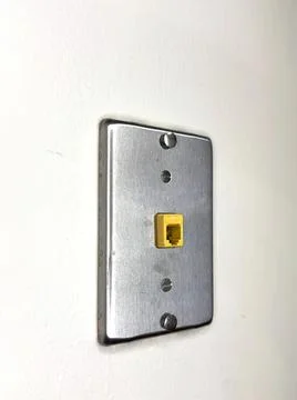 Close-up of ethernet wall socket on plain wall Stock Photos