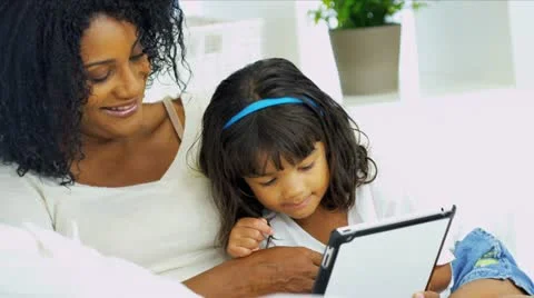 Close Up Ethnic Mom Child Using Tablet Technology Stock Footage