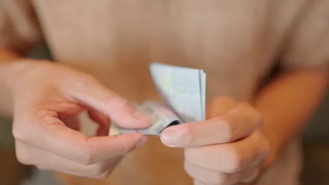 Close-up of euro banknotes in the hands of an elderly man. Stock Footage 252071563