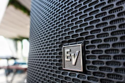 Close-up of the EV Electro Voice logo on large speakers set up at a outdoor Stock Photos