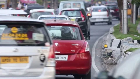 Close up evening rush hour traffic India Stock Footage