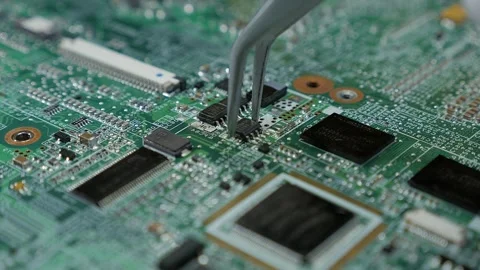 Close examination of a circuit board with intricate components visible Stock Footage 325036874