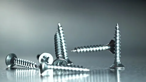 Close examination of single screw in construction scene Filmed on a high-speed Stock Footage 335412251