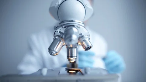 Close up of examining of test sample under the microscope Video stock 85139407