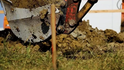 Close up of an excavating machine digging a hole. Construction site Vídeo Stock 97931805