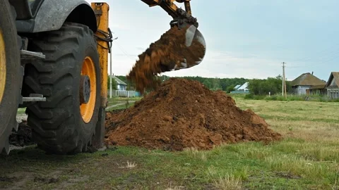 Close up of an excavator digging a deep trench Stock Footage 157772927