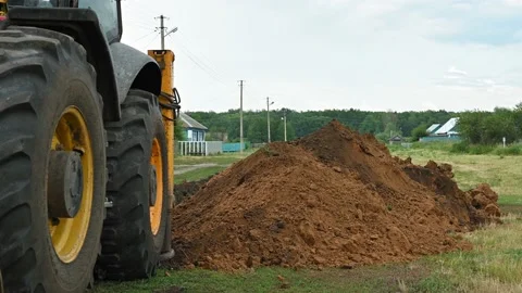 Close up of an excavator digging a deep trench Stock Footage 157832171