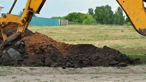 Close up of an excavator digging a deep trench Stock Footage 157847087