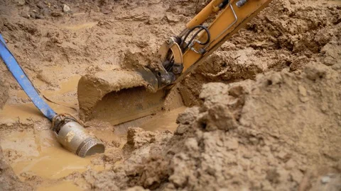 Close-up Of Excavator Digging In Muddy Sand Stock Footage 129398745