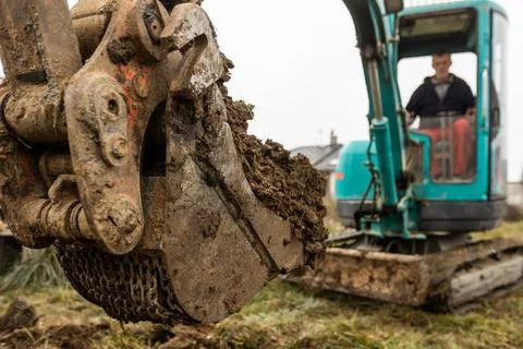 Close up of excavator or digger digging some soil or clay, industrial concept 库存照片