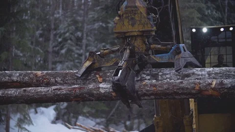 Close Up - Excavator Sorting Lumber In Winter Stock Footage 106598342