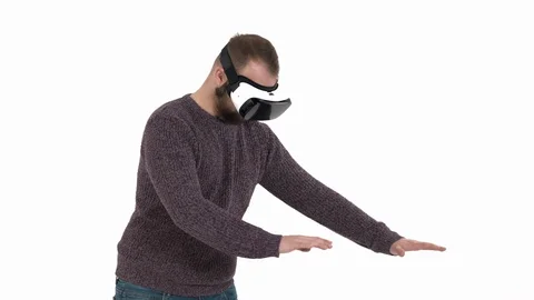 Close-up of an excited young man in virtual digital glasses touching virtual 스톡 동영상 121193624