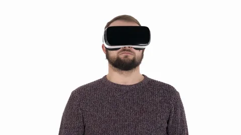 Close-up of an excited young man in virtual digital glasses looking up and down. Video stock 121194171