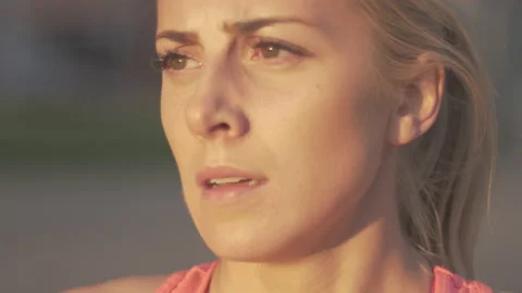 Close-up of exhausted athlete resting after jogging in the city. 動画素材 132760236