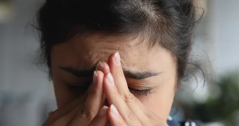 Close up exhausted frustrated young indian woman suffering from migraine. Stock Footage 126776904