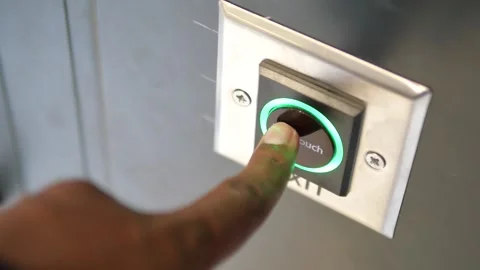Close up of an exit button on a hardwood door in electric blue font Stock Footage 279289326