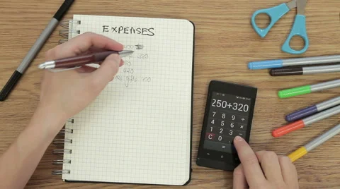 Close up of expenses being calculated, top view HD Video stock 49394345