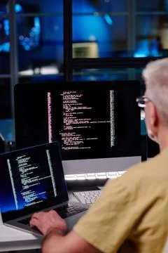 Close-up of experienced male IT engineer using new software Stock Photos