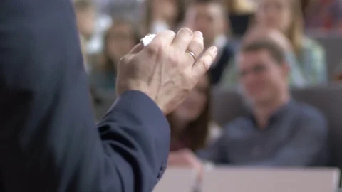 Close-up of experienced professor gesturing to explain the topic Stock Footage 69930305