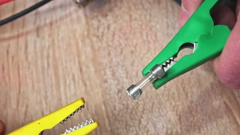 Close-up experiment with fuse blowing out. The master demonstrates the power  Stock-Footage 130779568