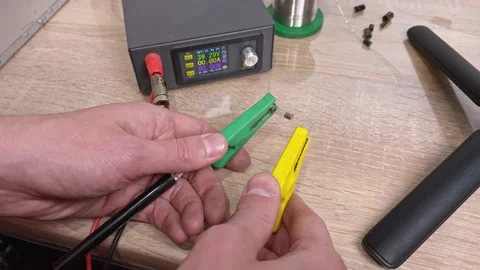Close-up experiment with fuse blowing out. The master demonstrates the power  스톡 동영상 130791541