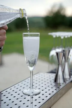 Close-up of expert bartender making cocktail on the bar Stock Photos