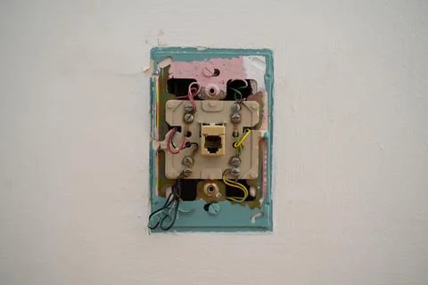 Close up of exposed wall socket wiring without cover plate Fotos de archivo