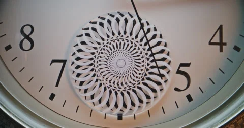 Close Up of Exquisite Wall Clock with Floral Mandala Ornament Showing Precise Stock Footage 317826322