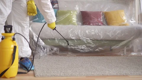 Close up of the exterminator is cleaning the carpet with a spray Stock Footage 105476964