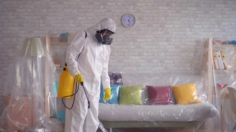 Close up of the exterminator is cleaning the room with a spray Stock Footage 105607449
